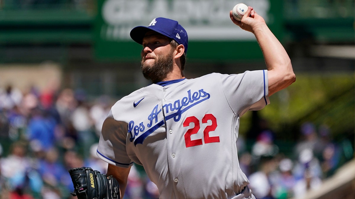 Los Angeles Dodgers starting pitcher Clayton Kershaw throws against the Chicago Cubs during the first inning in the first baseball game of a doubleheader, Saturday, May 7, 2022, in Chicago. 