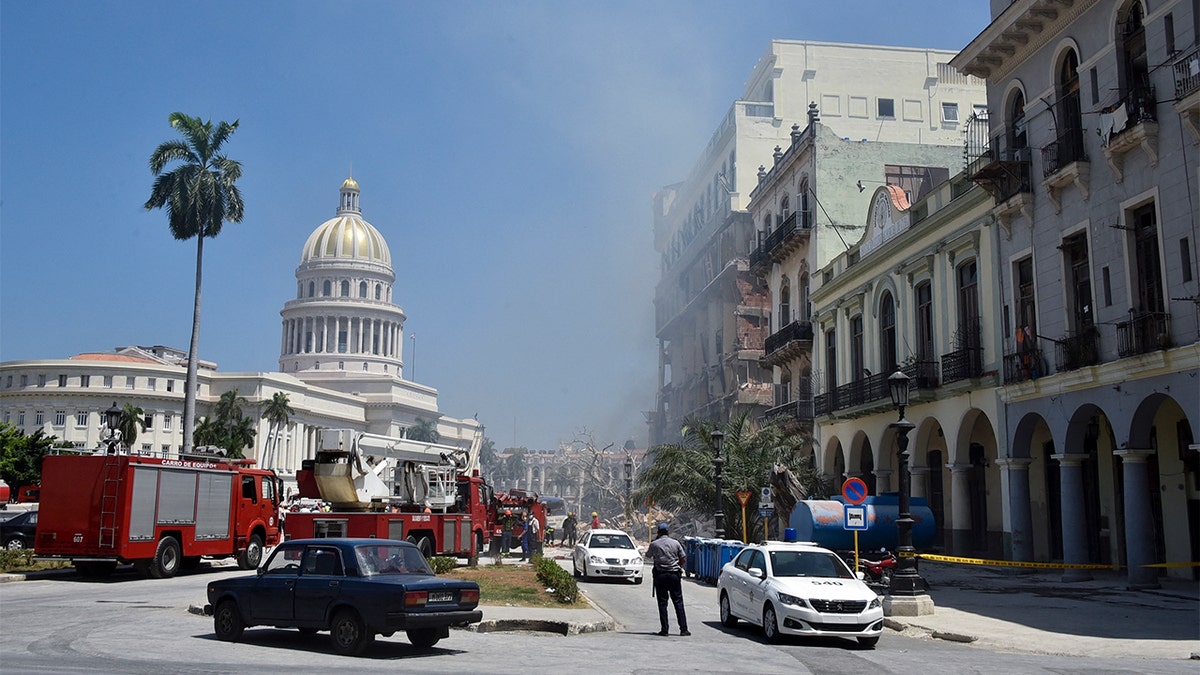 Rescuers work after an explosion in the Saratoga Hotel in Havana, on May 6, 2022. A powerful explosion Friday destroyed part of a hotel under repair in central Havana, AFP witnessed. (Photo by ADALBERTO ROQUE/AFP via Getty Images)