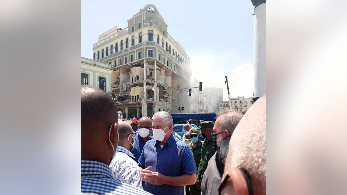 Cuban President Miguel Díaz-Canel Bermúdez is seen in front of the Hotel Saratoga, where an explosion killed at least four people, an official said Friday, May 6, 2022.