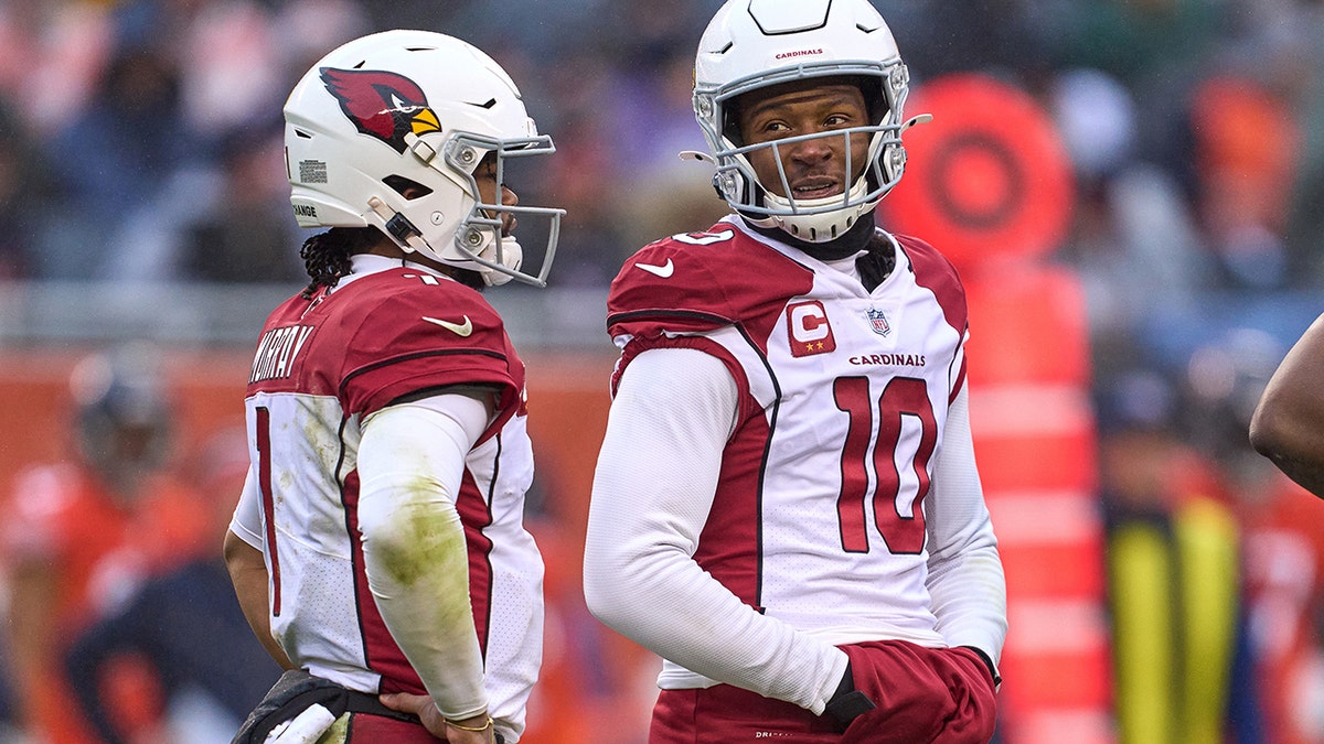 Arizona Cardinals quarterback Kyler Murray (1) and Arizona Cardinals wide receiver DeAndre Hopkins (10) chat during a game between the Arizona Cardinals and the Chicago Bears on December 5, 2021 at Soldier Stadium, in Chicago, IL.