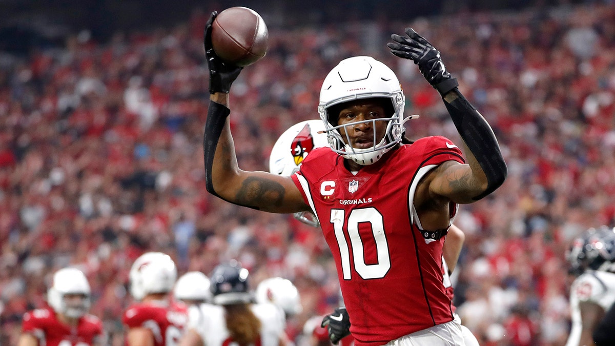 DeAndre Hopkins #10 of the Arizona Cardinals celebrates after scoring a touchdown in the second quarter against the Houston Texans in the game at State Farm Stadium on Oct. 24, 2021 in Glendale, Arizona.