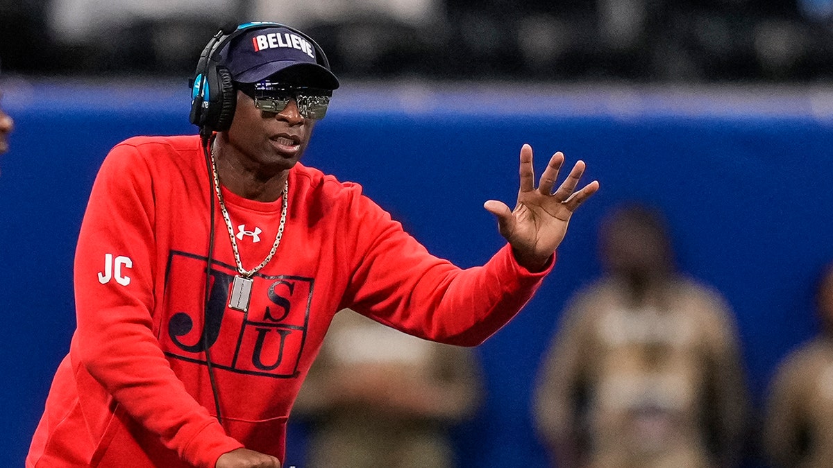 Deion Sanders coaches in late 2021