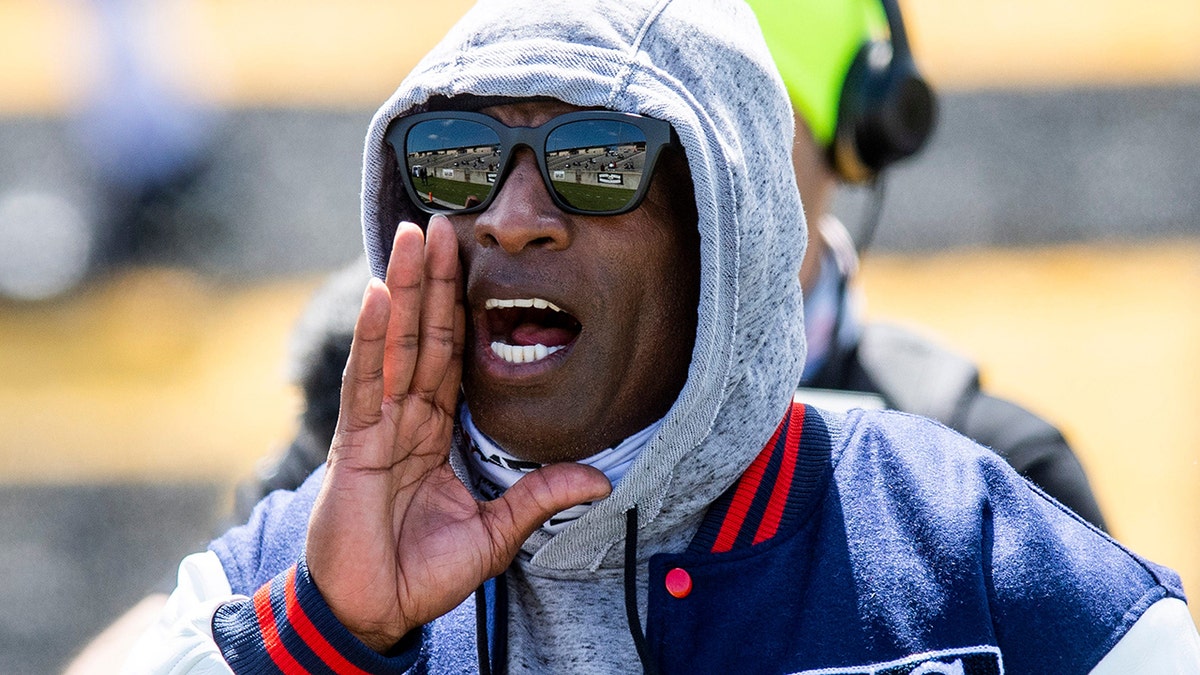 Deion Sanders coaches in early 2021
