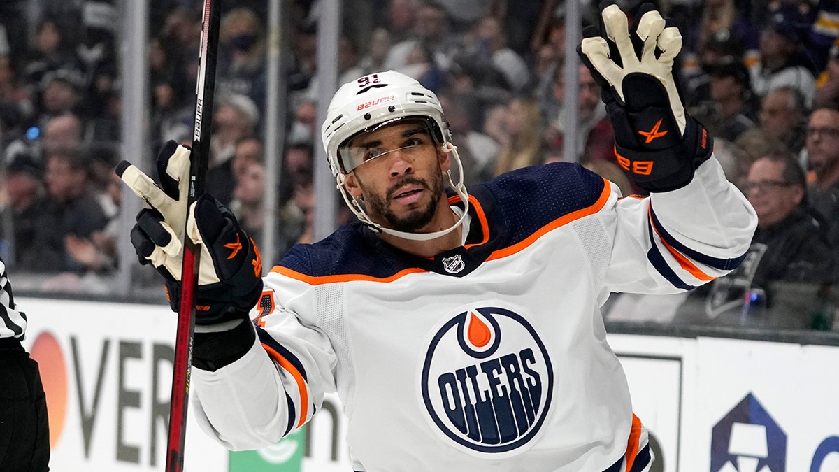 Edmonton Oilers left wing Evander Kane gestures after scoring an empty net goal during the third period in Game 6 of an NHL hockey Stanley Cup first-round playoff series against the Los Angeles Kings Thursday, May 12, 2022, in Los Angeles.