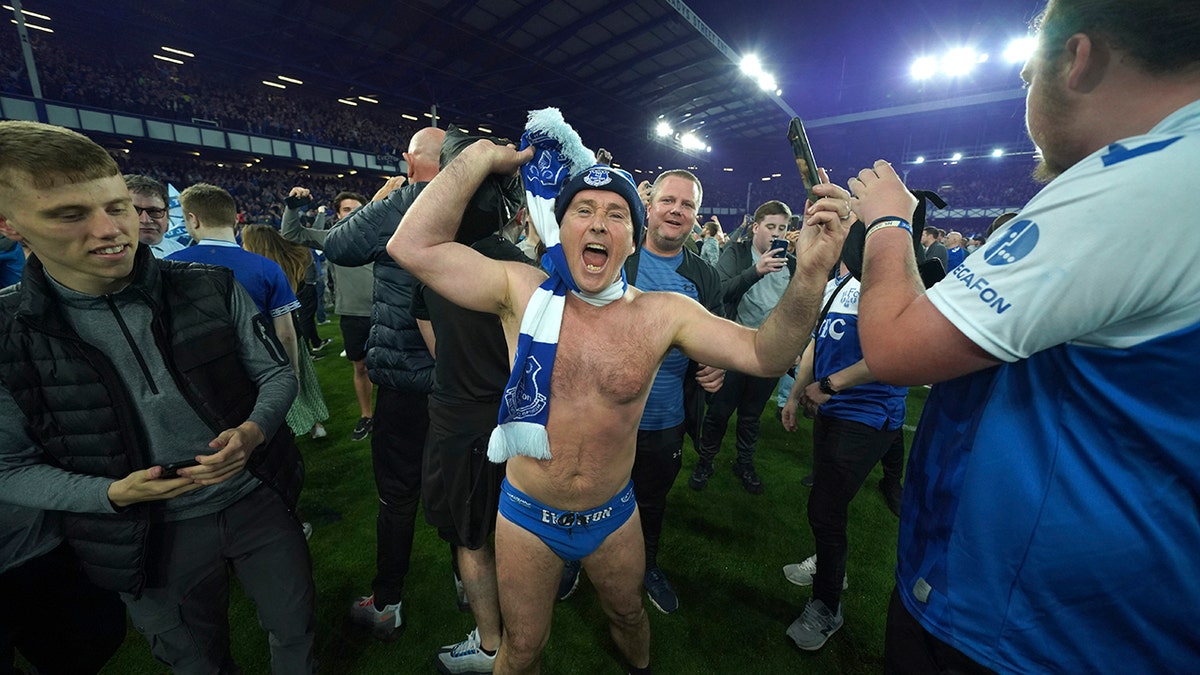 Everton supporters celebrate the team's win