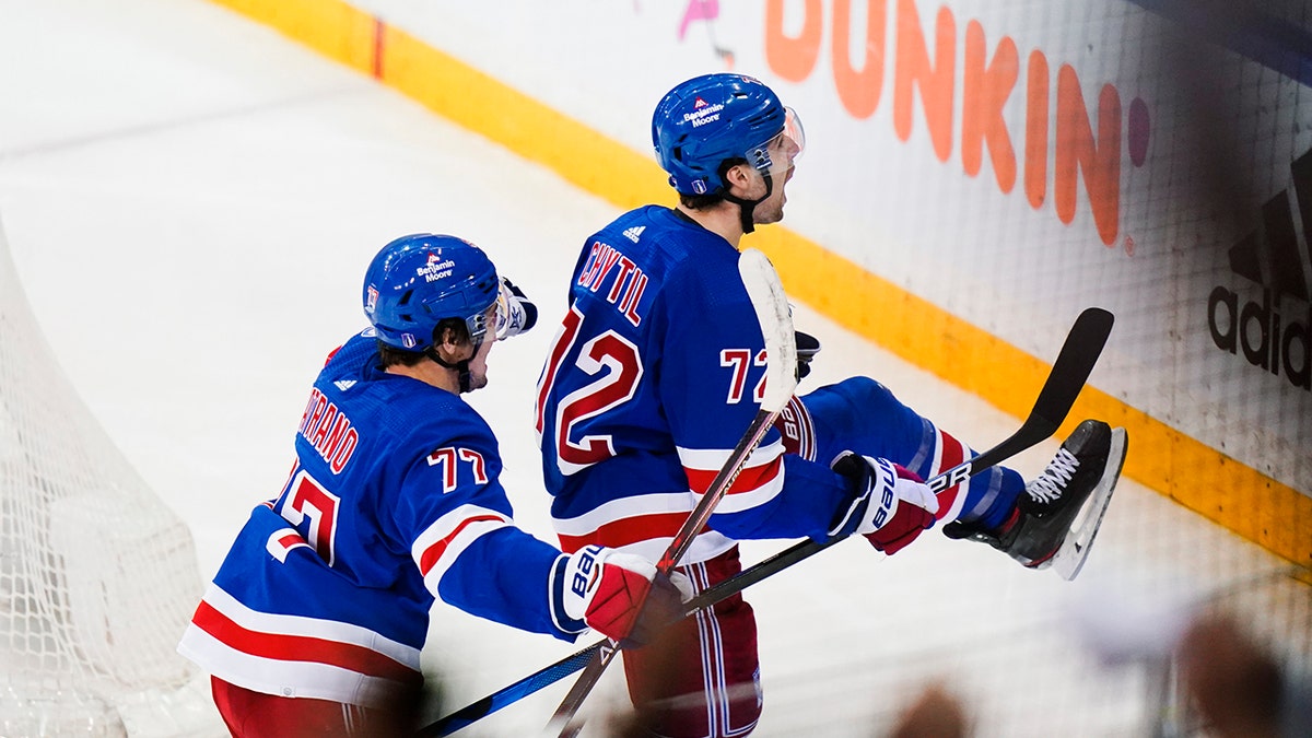 New York Rangers' Filip Chytil (72) celebrates with teammate Frank Vatrano (77) after scoring a goal during the third period of Game 5 of an NHL hockey Stanley Cup first-round playoff series against the Pittsburgh Penguins Wednesday, May 11, 2022, in New York. The Rangers won 5-3.