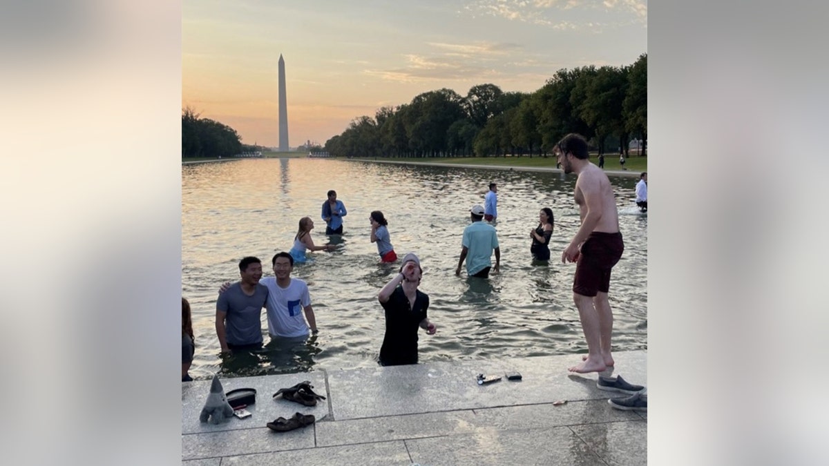 Georgetown University students wade in Reflecting Pool