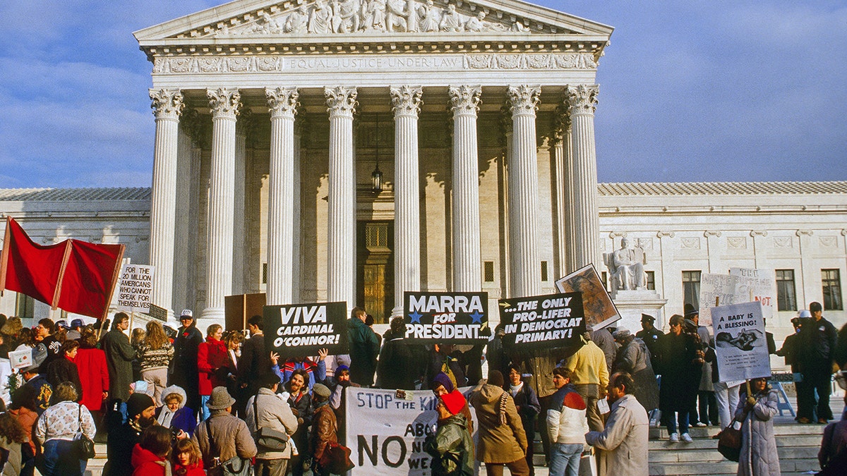 Pro life demonstrators stand in front of the US Supreme Court building during the annual Right To Life March, Washington DC, January 22, 1988. (Photo by Mark Reinstein/Corbis via Getty Images)
