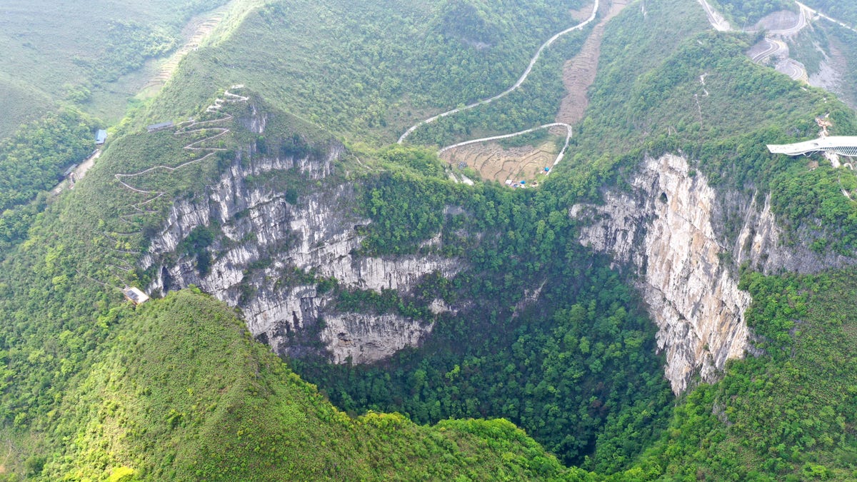 FILE - Aerial Photo taken on April 19, 2020, shows the scenery of Dashiwei Tiankeng, a giant karst sinkhole, at Leye-Fengshan Global Geopark in south China's Guangxi Zhuang Autonomous Region. The Leye-Fengshan Geopark was added to the UNESCO's Global Geopark List in 2010.?