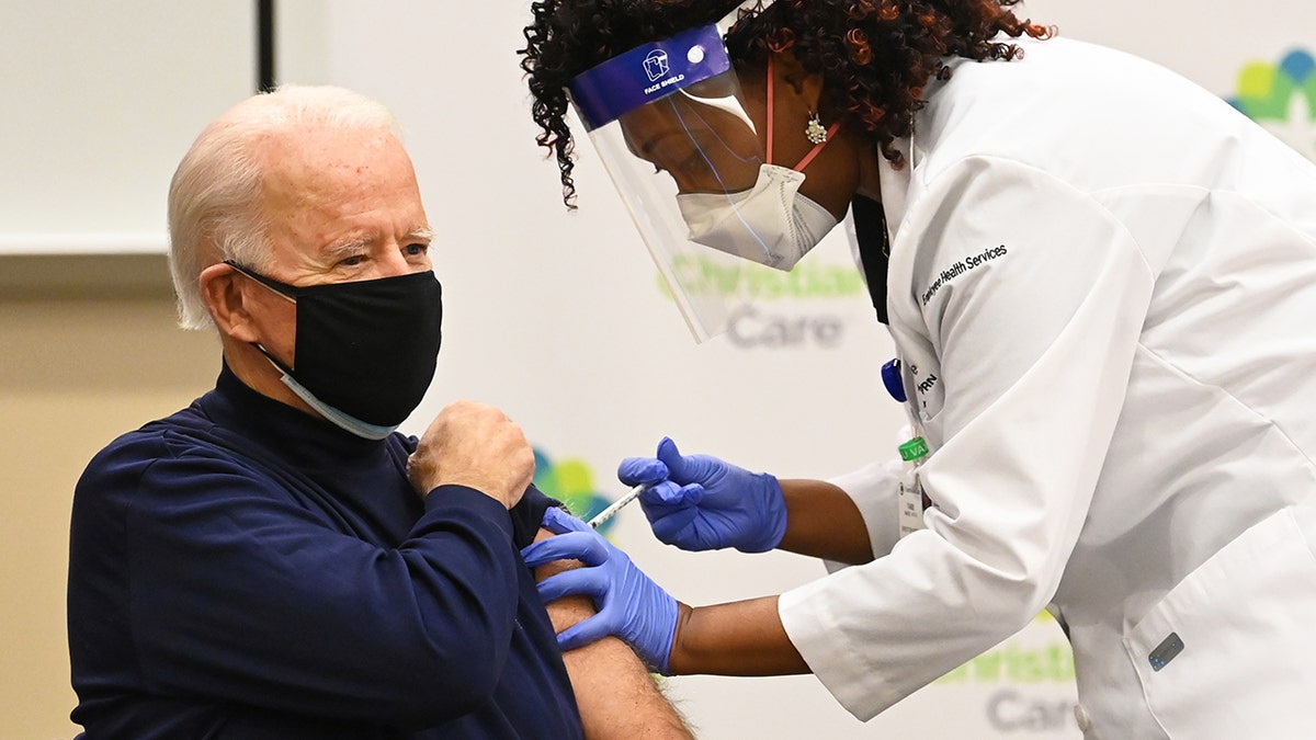WILMINGTON, DE - DECEMBER 21: Nurse Practitioner Tabe Mase gives President-elect Joe Biden his first dose of the coronavirus vaccine as part of a growing effort to convince the American public the inoculations are safe. (Photo by Jonathan Newton /The Washington Post via Getty Images)