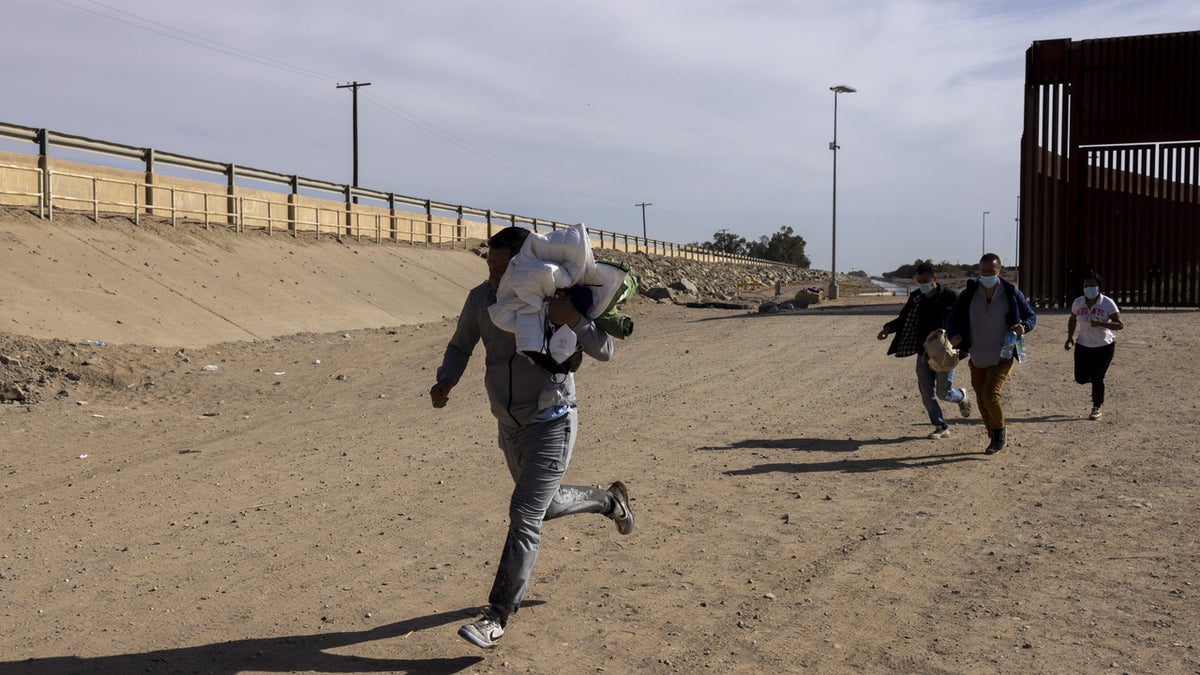 Migrants seeking asylum after crossing border.
