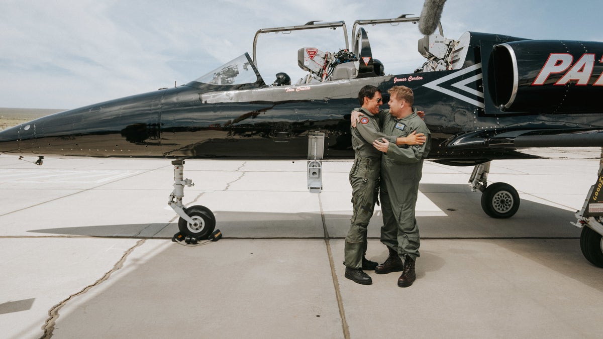 Tom Cruise congratulates James Corden for a successful flight on a fighter jet.