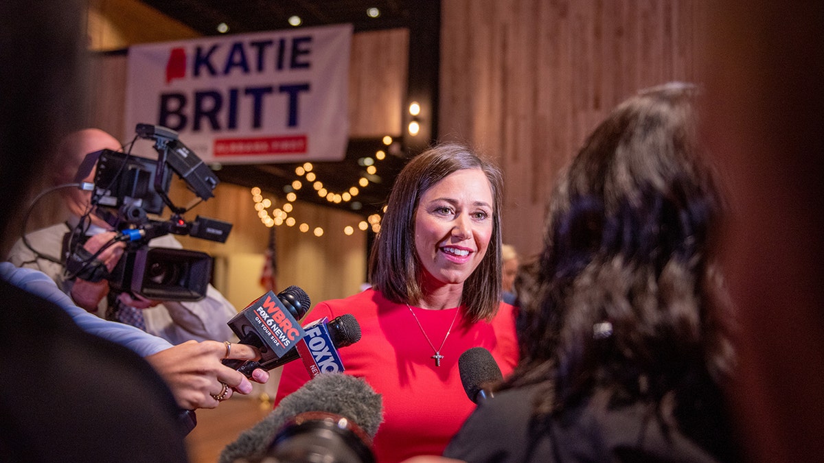 Katie Britt speaks to reporters