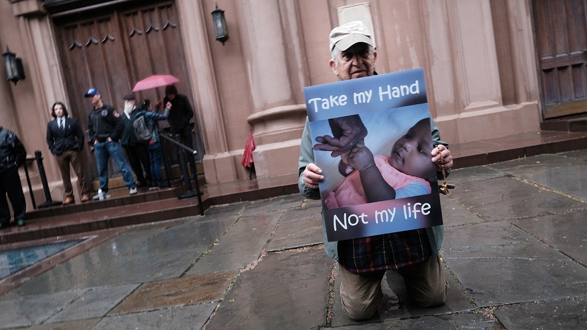 NEW YORK CITY - MAY 07: Anti-abortion activists confront a gathering of abortion-rights demonstrators outside of a Catholic church in downtown Manhattan on May 07, 2022 in New York City. The protests at the Basilica of St. Patricks Old Cathedral, which have been occurring weekly and where a small number of anti-abortion activists worship, have been given added urgency by the recent leaked Supreme Court ruling on Roe v. Wade. (Photo by Spencer Platt/Getty Images)