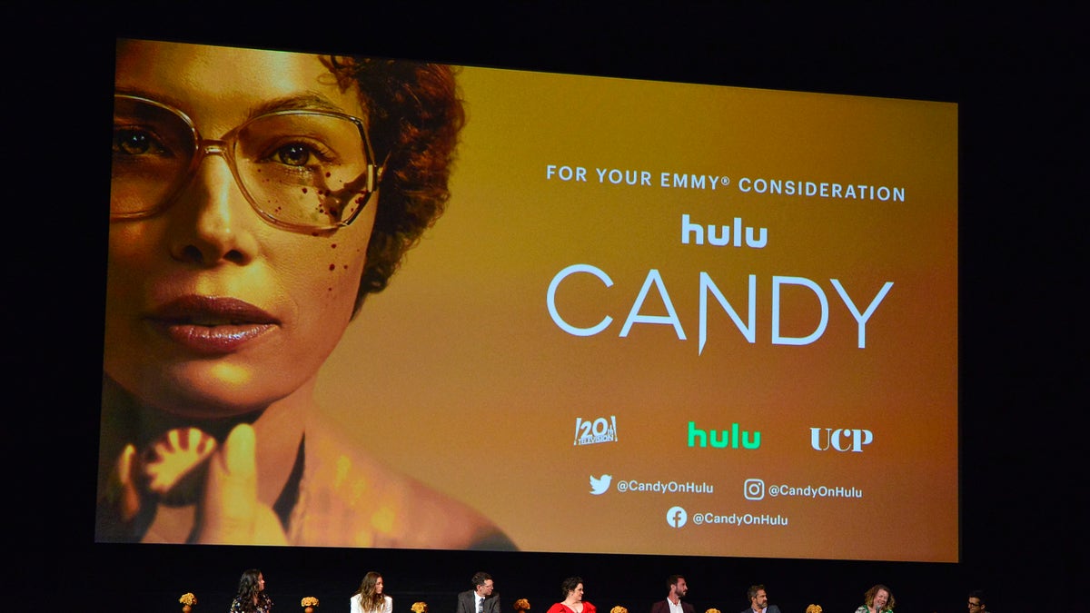 Moderator Rebecca Ford, Jessica Biel, Timothy Simons, Melanie Lynskey, Pablo Schreiber, Raul Esparza, Showrunner Robin Veith and Executive Producer Nick Antosca participate in a panel during the Los Angeles Premiere FYC Event For Hulu's 'Candy' at El Capitan Theatre on May 09, 2022 in Los Angeles, California.