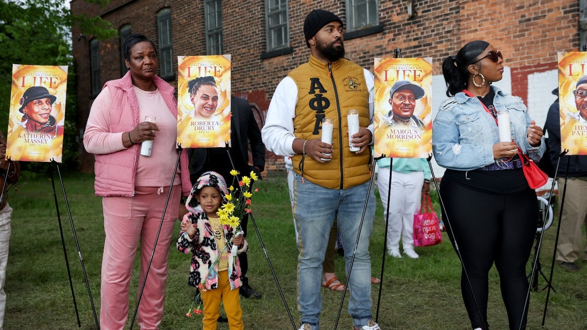 People participate in a vigil to honor the 10 people killed in Saturday's shooting at Tops market on May 17, 2022 in Buffalo, New York.