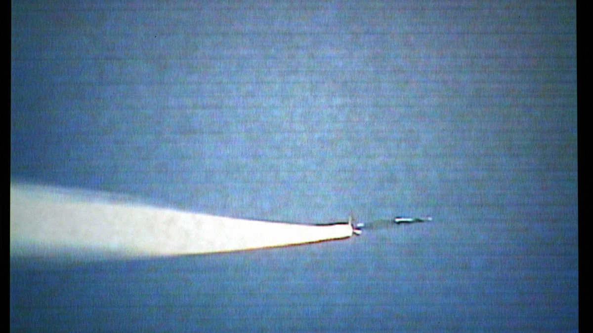 This image shows the launch of the experimental X-43A scramjet and its attached booster rocket as it is launched from a modified NASA B-52 bomber (NOT IN PHOTO) at 40,000 feet (13,000 meters) above the Pacific Ocean off the coast of California, 27 March 2004.