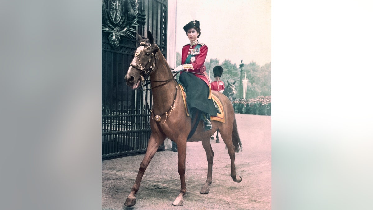 Queen Elizabeth riding a horse