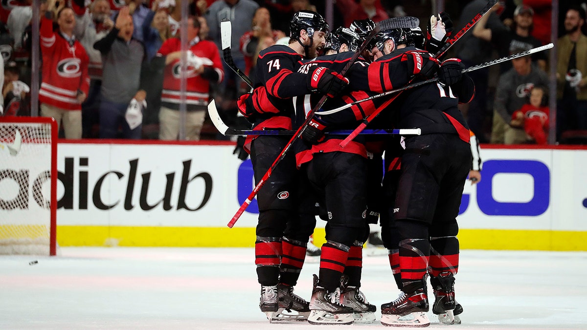 The Carolina Hurricanes celebrate a goal against the Boston Bruins during the first period of Game 2 of an NHL hockey Stanley Cup first-round playoff series in Raleigh, N.C., Wednesday, May 4, 2022.