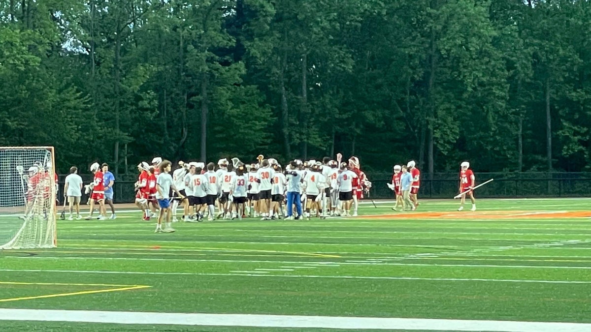 Lacrosse team celebrates after win