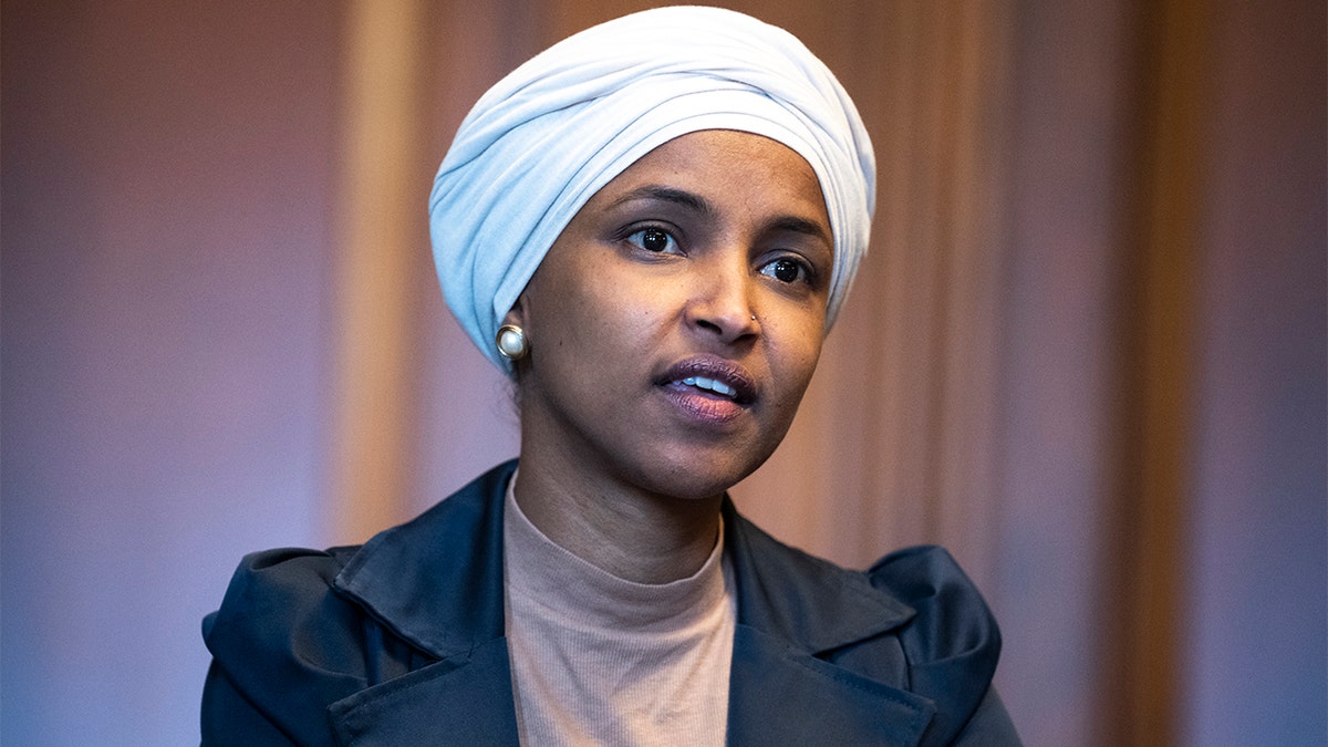 Rep. Ilhan Omar, D-Minn., is seen in the U.S. Capitols Rayburn Room during a group photo with the Congressional Black Caucus, on Wednesday, April 6, 2022. (Tom Williams/CQ-Roll Call, Inc via Getty Images)