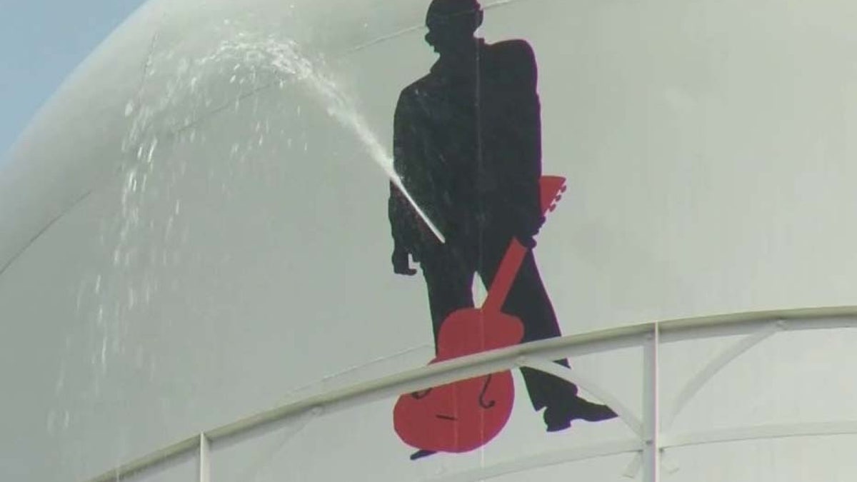 Johnny Cash mural on water tank leaking