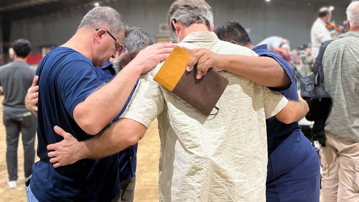 Family prays together at vigil