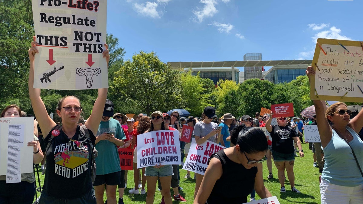 Woman holds anti-gun sign