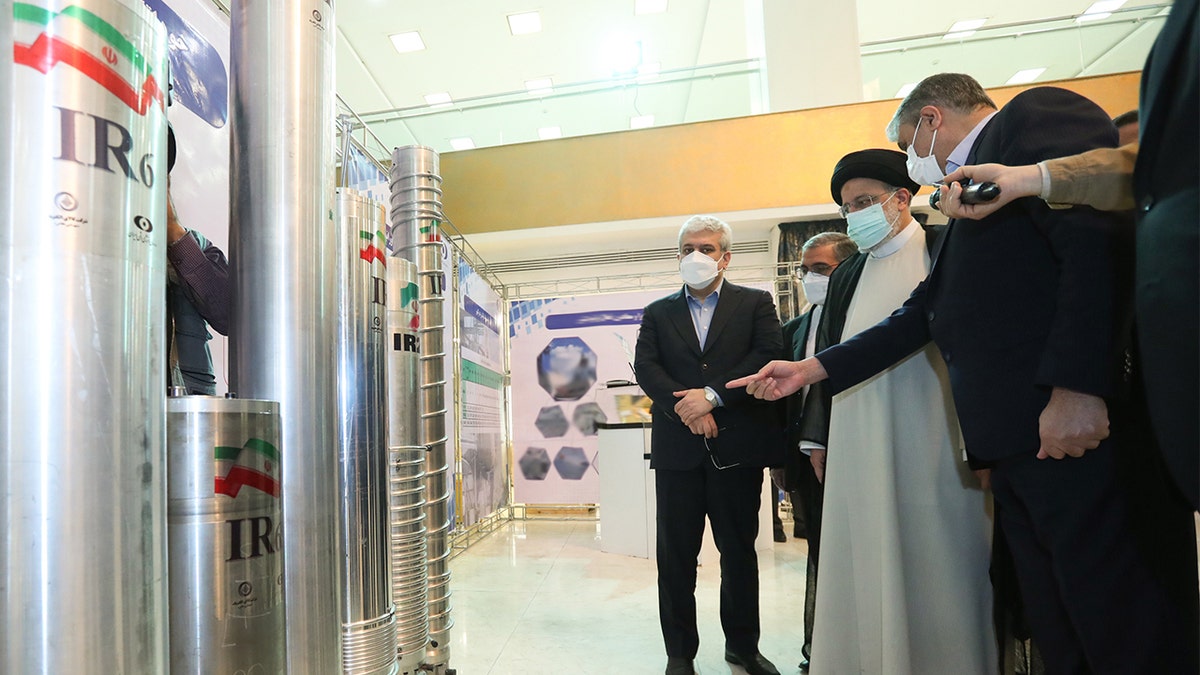 Iranian President Ebrahim Reisi participates in an exhibition organized by the Atomic Energy Organization of Iran on the occasion of the National Nuclear Technology Day at the International Conference Center in Tehran, Iran on April 9, 2022. Mohammad Eslami, Head of the Atomic Energy Organization of Iran, accompanied the Iranian president during his visit to the exhibition. (Photo by Iranian Presidency/Anadolu Agency via Getty Images)