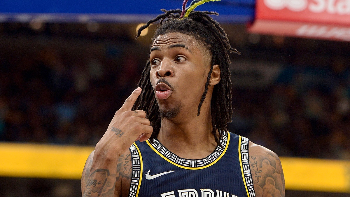 Memphis Grizzlies guard Ja Morant reacts after scoring during the second half of Game 2 of the team's second-round NBA basketball playoff series against the Golden State Warriors on Tuesday, May 3, 2022, in Memphis, Tenn. The Grizzlies won 106-101.