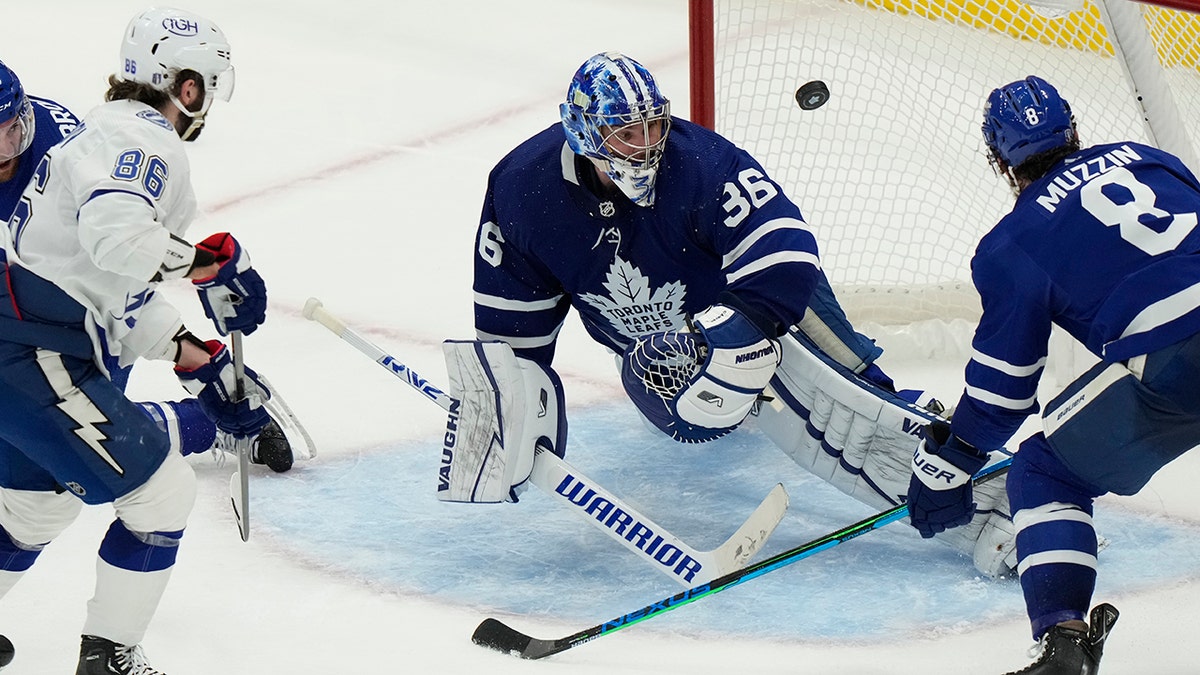 A shot from Tampa Bay Lightning defenceman Ryan McDonagh (27) beats Toronto Maple Leafs goaltender Jack Campbell (36) as Tampa Bay Lightning right wing Nikita Kucherov (86) and Leafs defenceman Jake Muzzin (8) look on during third period of Game 5 of an NHL hockey Stanley Cup first-round playoff series, Tuesday, May 10, 2022, in Toronto.