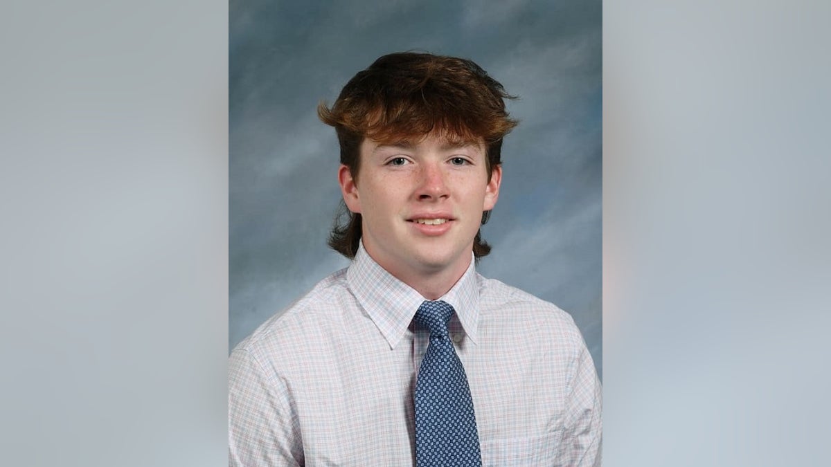 James McGrath smiles and wearing a tie