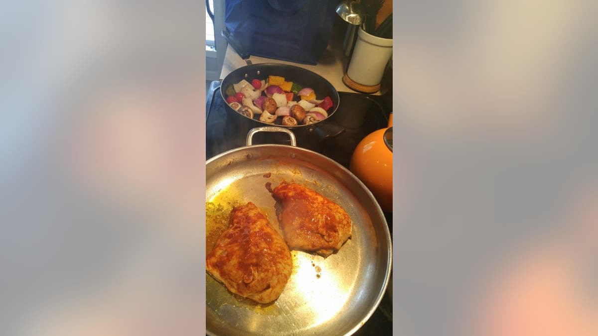 Jillian Amodio cooks chicken in skillet