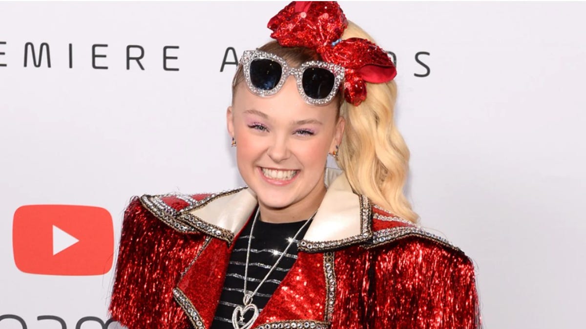 JoJo Siwa poses on the red carpet