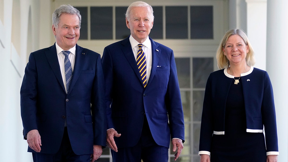 President Biden walks with Prime Minister Magdalena Andersson of Sweden and President Sauli Niinisto of Finland