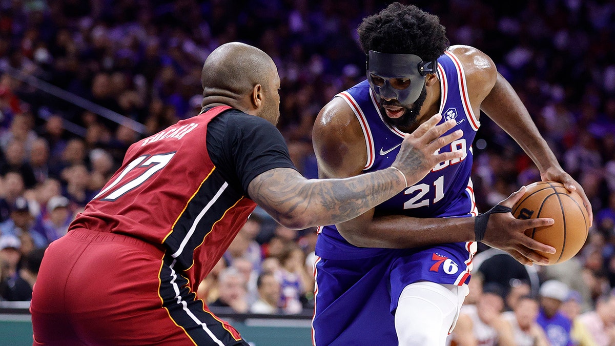 Joel Embiid #21 of the Philadelphia 76ers controls the ball against P.J. Tucker #17 of the Miami Heat in Game Six of the 2022 NBA Playoffs Eastern Conference Semifinals at Wells Fargo Center on May 12, 2022 in Philadelphia, Pennsylvania.