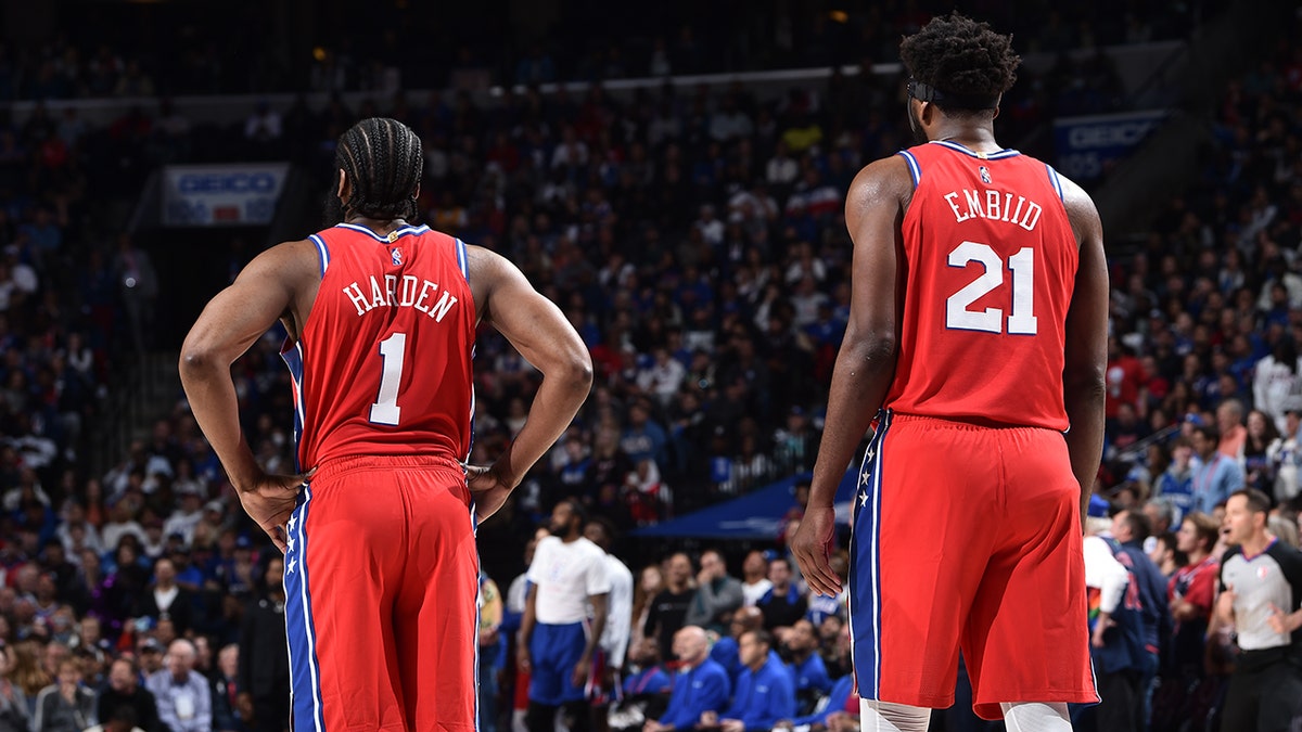 James Harden #1 and Joel Embiid #21 of the Philadelphia 76ers look on against the Miami Heat on May 8, 2022 at the Wells Fargo Center in Philadelphia, Pennsylvania.