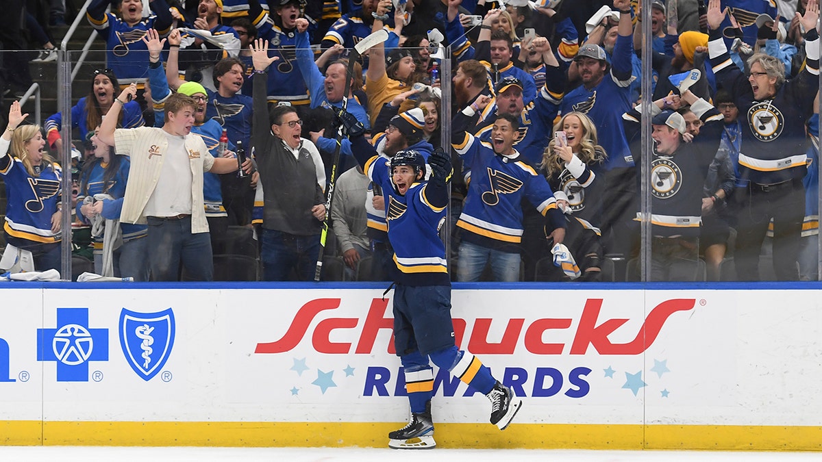 St. Louis Blues' Jordan Kyrou (25) celebrates after scoring a goal during the second period in Game 4 of an NHL hockey Stanley Cup first-round playoff series against the Minnesota Wild, Sunday, May 8, 2022, in St. Louis. 