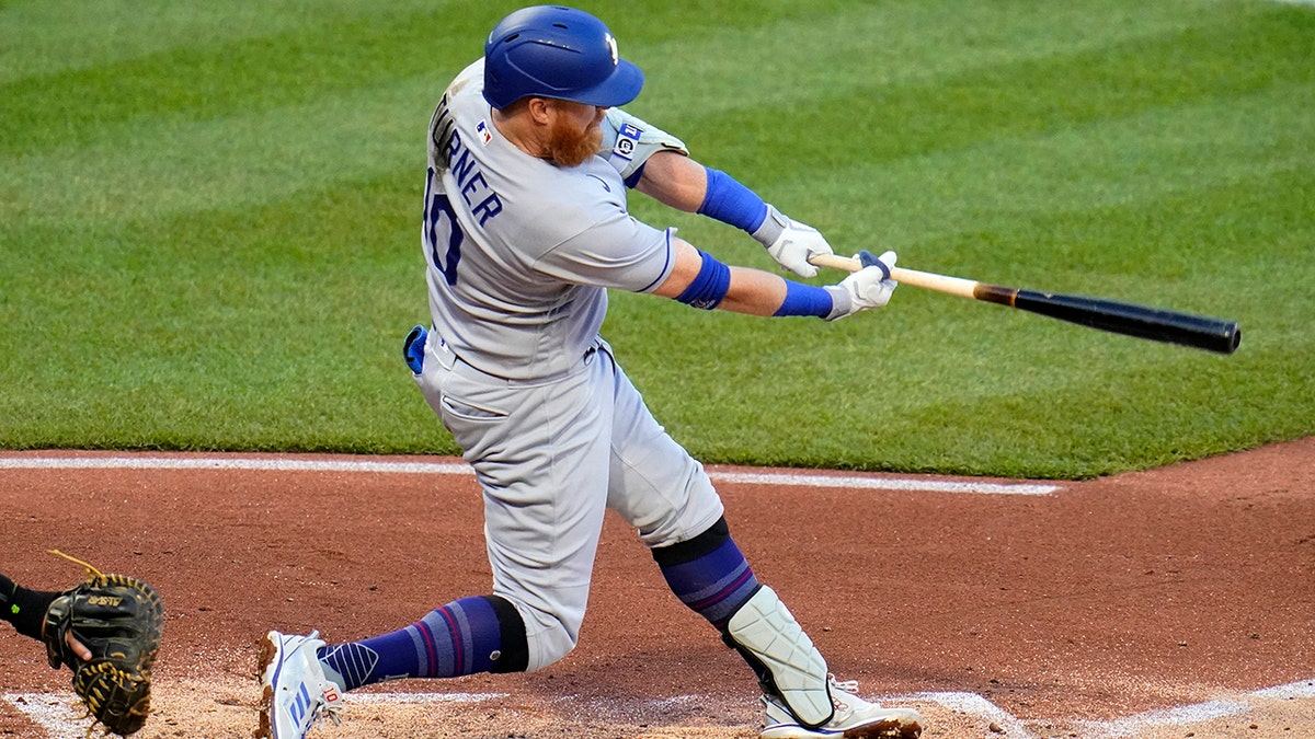 Los Angeles Dodgers' Justin Turner doubles off Pittsburgh Pirates starting pitcher Bryse Wilson, driving in two runs, during the third inning of a baseball game in Pittsburgh, Tuesday, May 10, 2022.