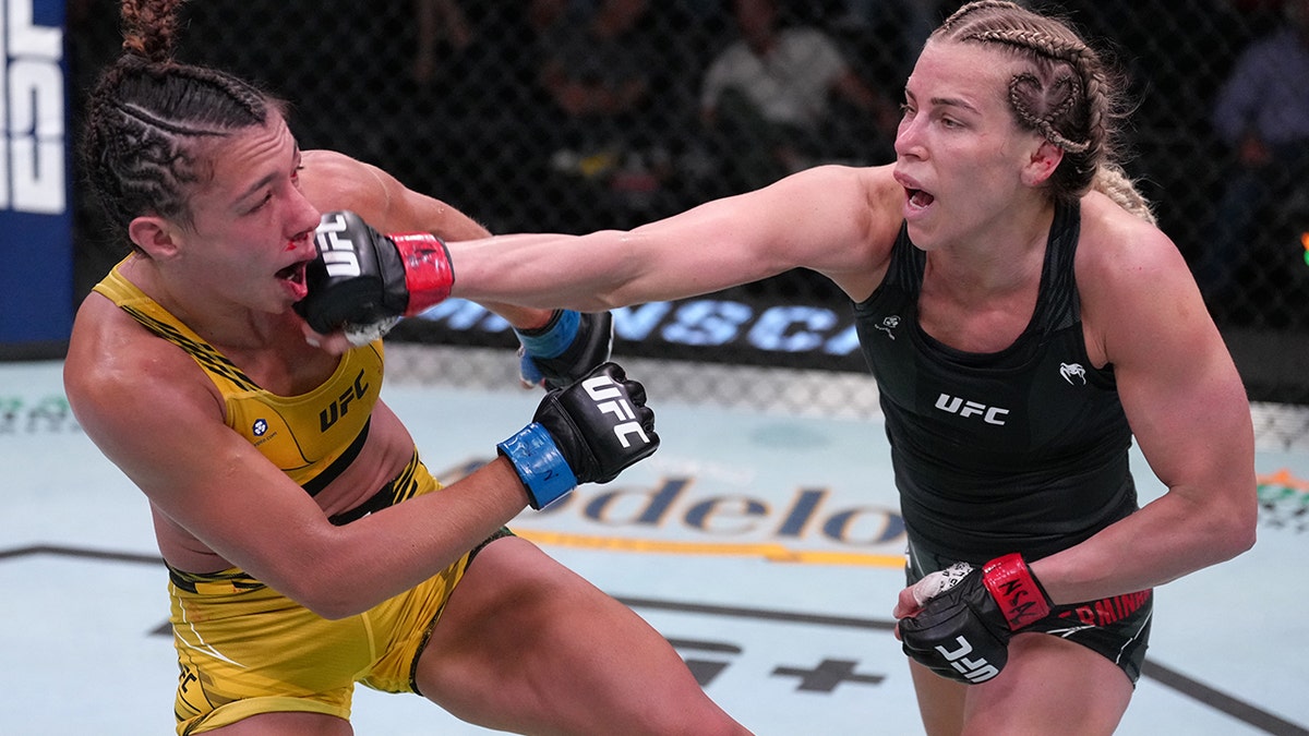 Katlyn Chookagian punches Amanda Ribas of Brazil in a flyweight fight at UFC APEX on May 14, 2022 in Las Vegas, Nevada.