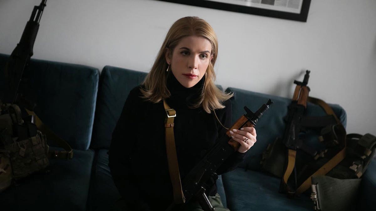 Kira Rudik with Kalashnikov