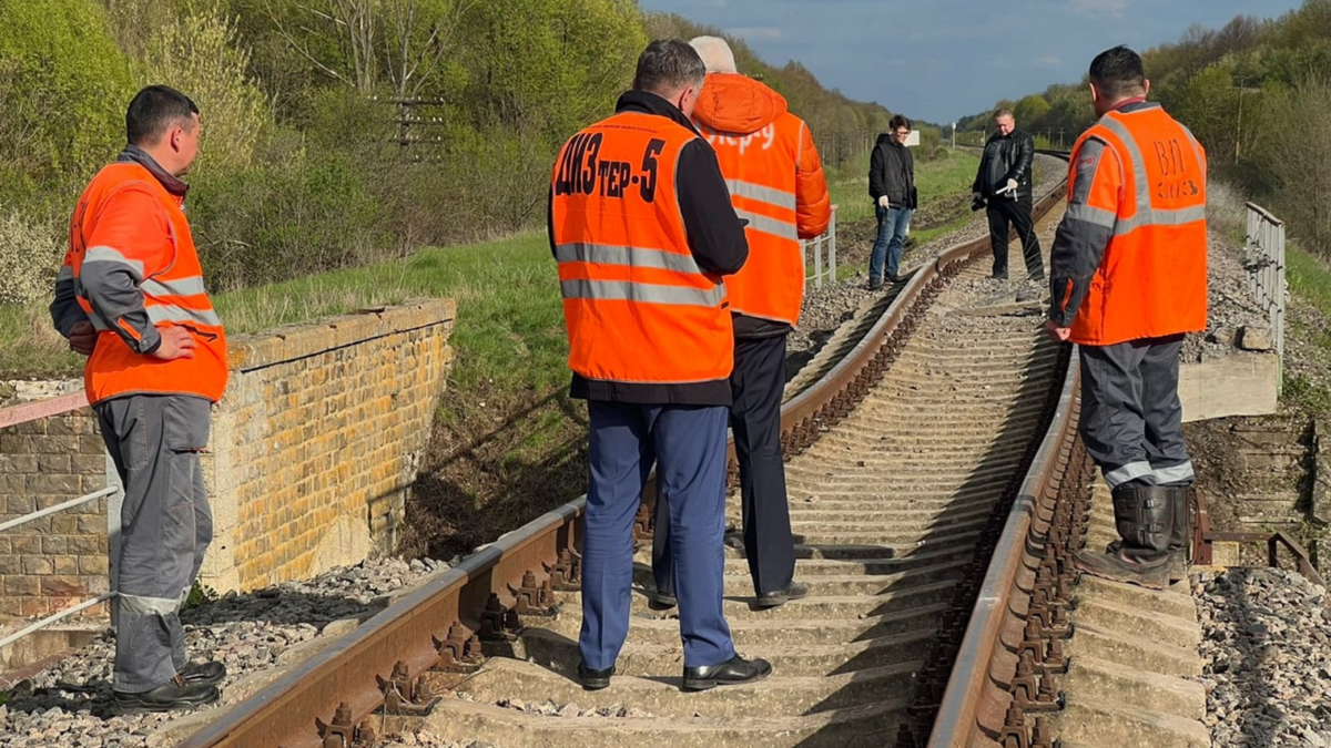 Russian officials gather at site of the reported bridge attack.