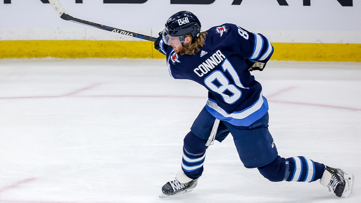 Kyle Connor #81 of the Winnipeg Jets takes a shot on goal during first period action against the Calgary Flames at the Canada Life Centre on April 29, 2022 in Winnipeg, Manitoba, Canada.
