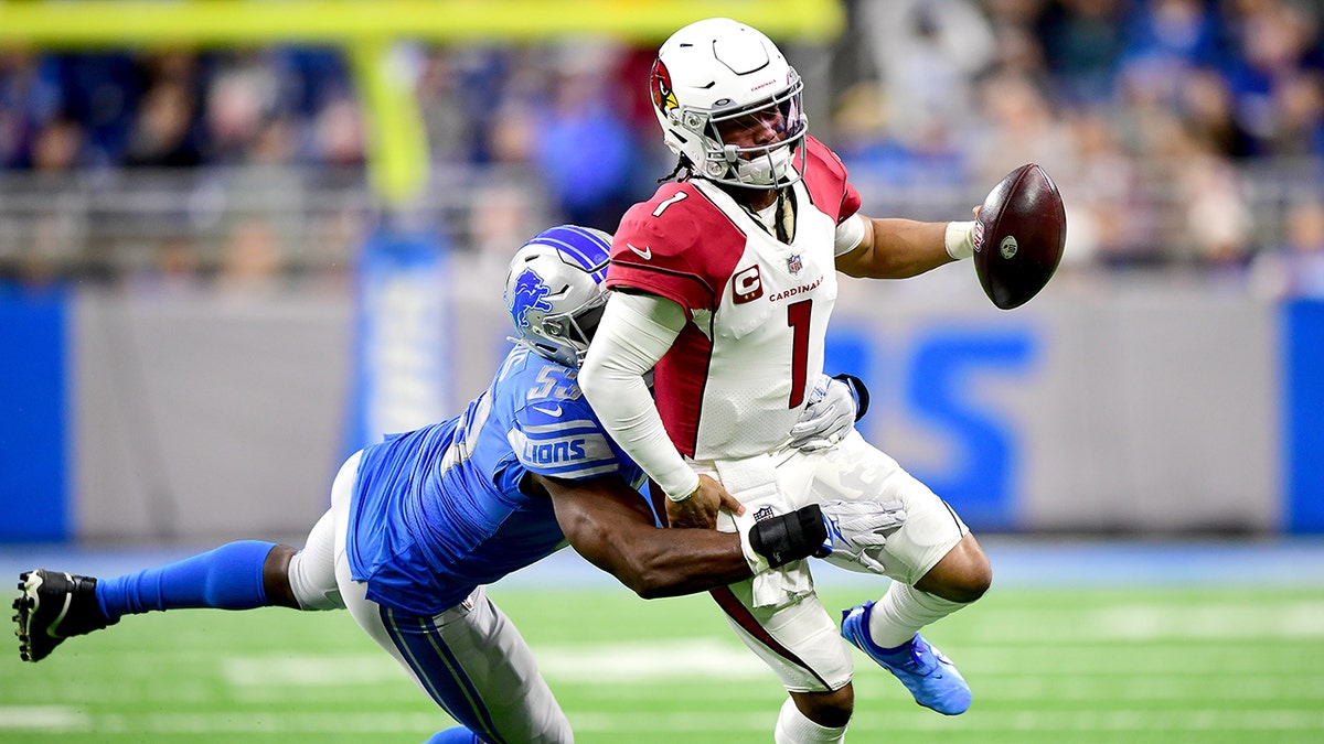 Charles Harris #53 of the Detroit Lions tackles Kyler Murray #1 of the Arizona Cardinals during the first quarter at Ford Field on December 19, 2021 in Detroit, Michigan.