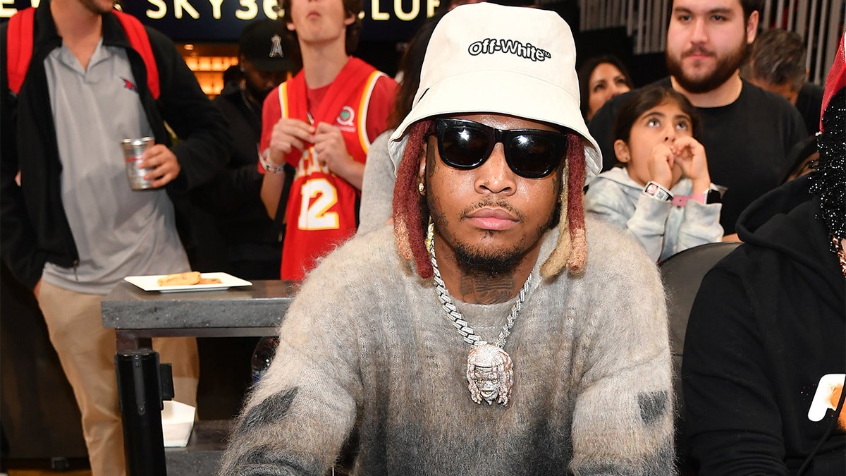 Rapper Lil Keed attends the game between the New Orleans Pelicans and the Atlanta Hawks at State Farm Arena on March 20, 2022, in Atlanta. (Photo by Paras Griffin/Getty Images)