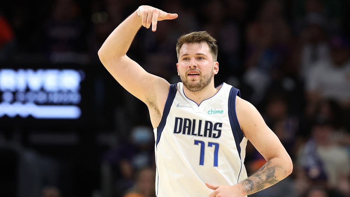 Luka Doncic #77 of the Dallas Mavericks reacts after making a three point basket during the third quarter against the Phoenix Suns in Game Seven of the 2022 NBA Playoffs Western Conference Semifinals at Footprint Center on May 15, 2022 in Phoenix, Arizona.?