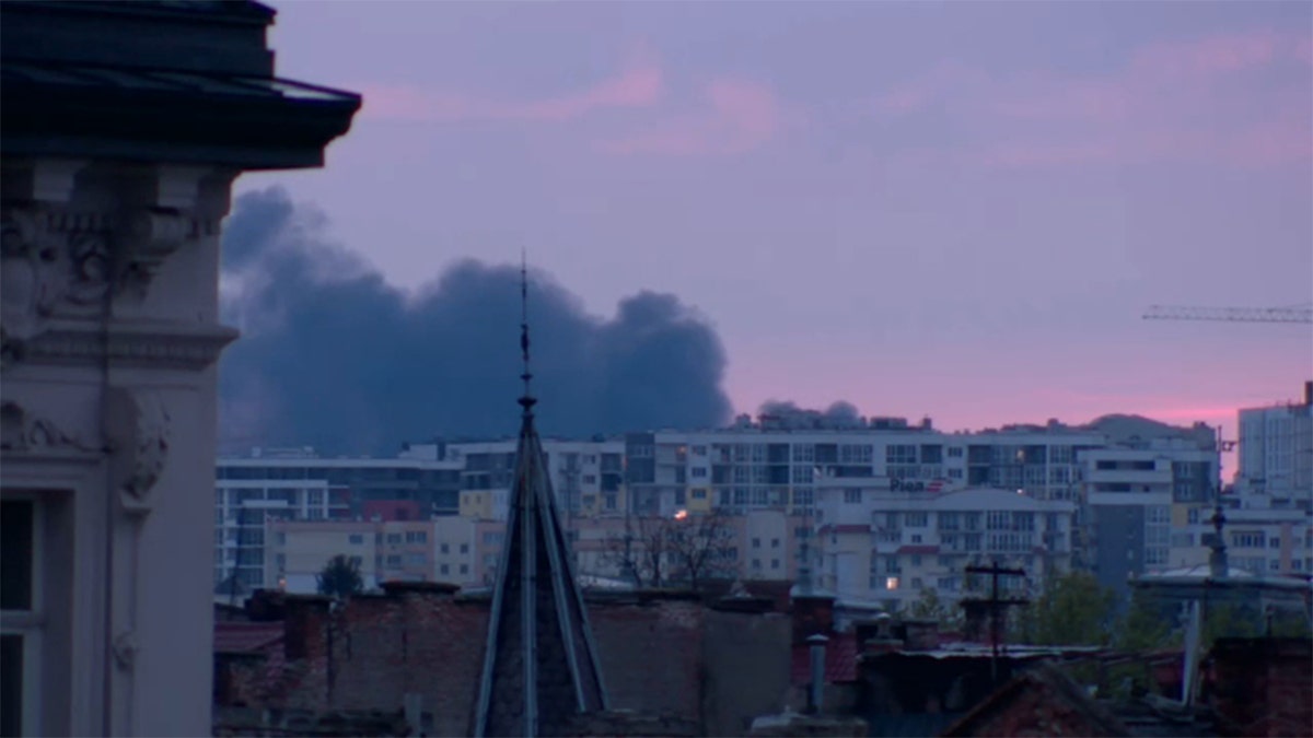 Smoke was seen in Lviv, Ukraine, after the mayor said explosions and power outages hit the city, Tuesday, May 3, 2022.