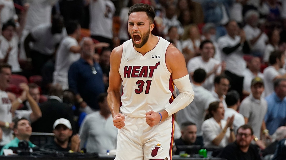 Miami Heat guard Max Strus (31) celebrates after scoring a three-point shot during the first half of Game 5 of an NBA basketball second-round playoff series against the Philadelphia 76ers, Tuesday, May 10, 2022, in Miami.?