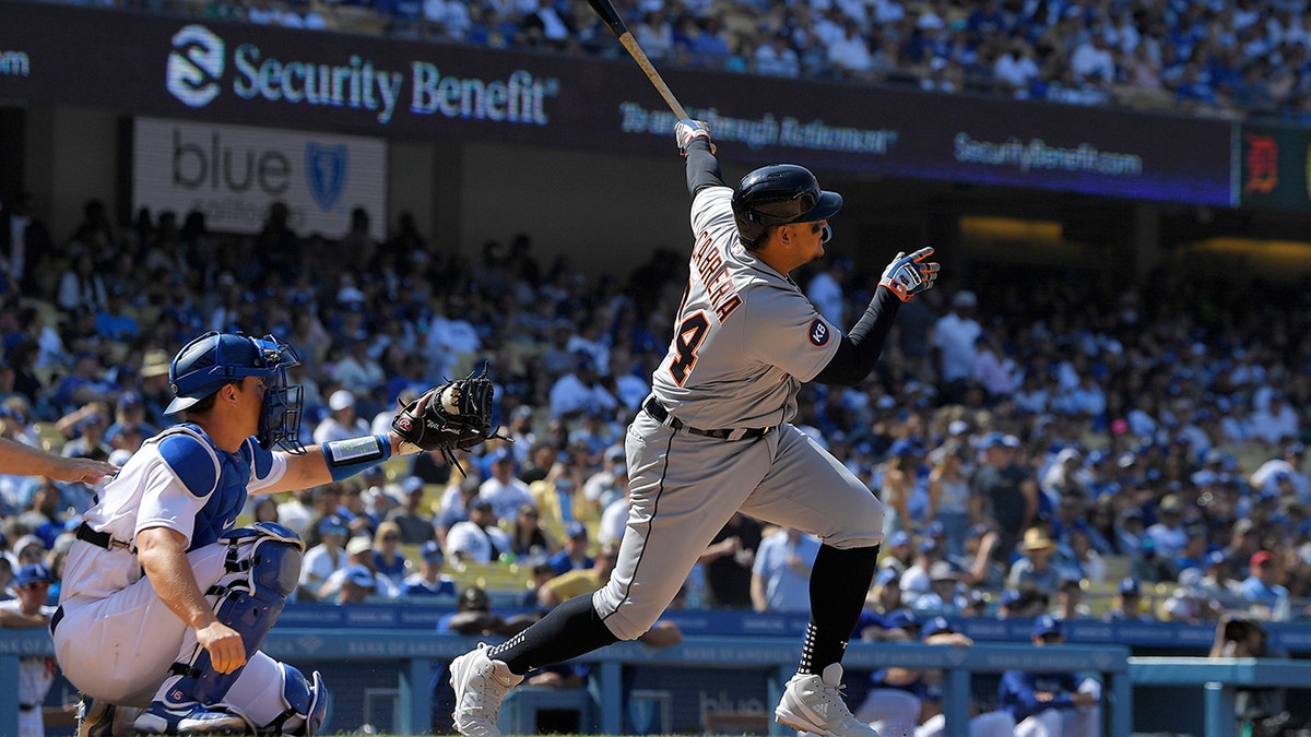 Detroit Tigers' Miguel Cabrera, right, hits a two-run home run as Los Angeles Dodgers catcher Will Smith watches during the eighth inning of a baseball game Sunday, May 1, 2022, in Los Angeles. 