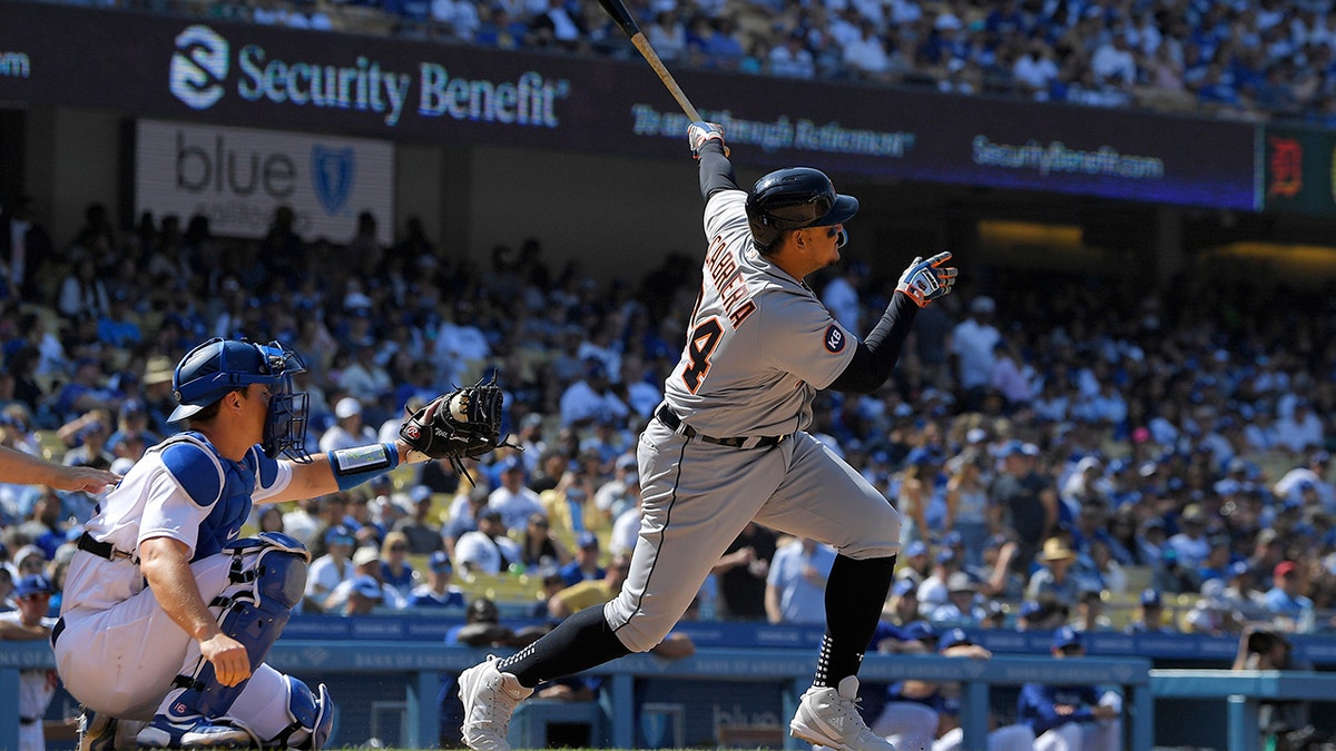 Detroit Tigers' Miguel Cabrera, right, hits a two-run home run as Los Angeles Dodgers catcher Will Smith watches during the eighth inning of a baseball game Sunday, May 1, 2022, in Los Angeles.